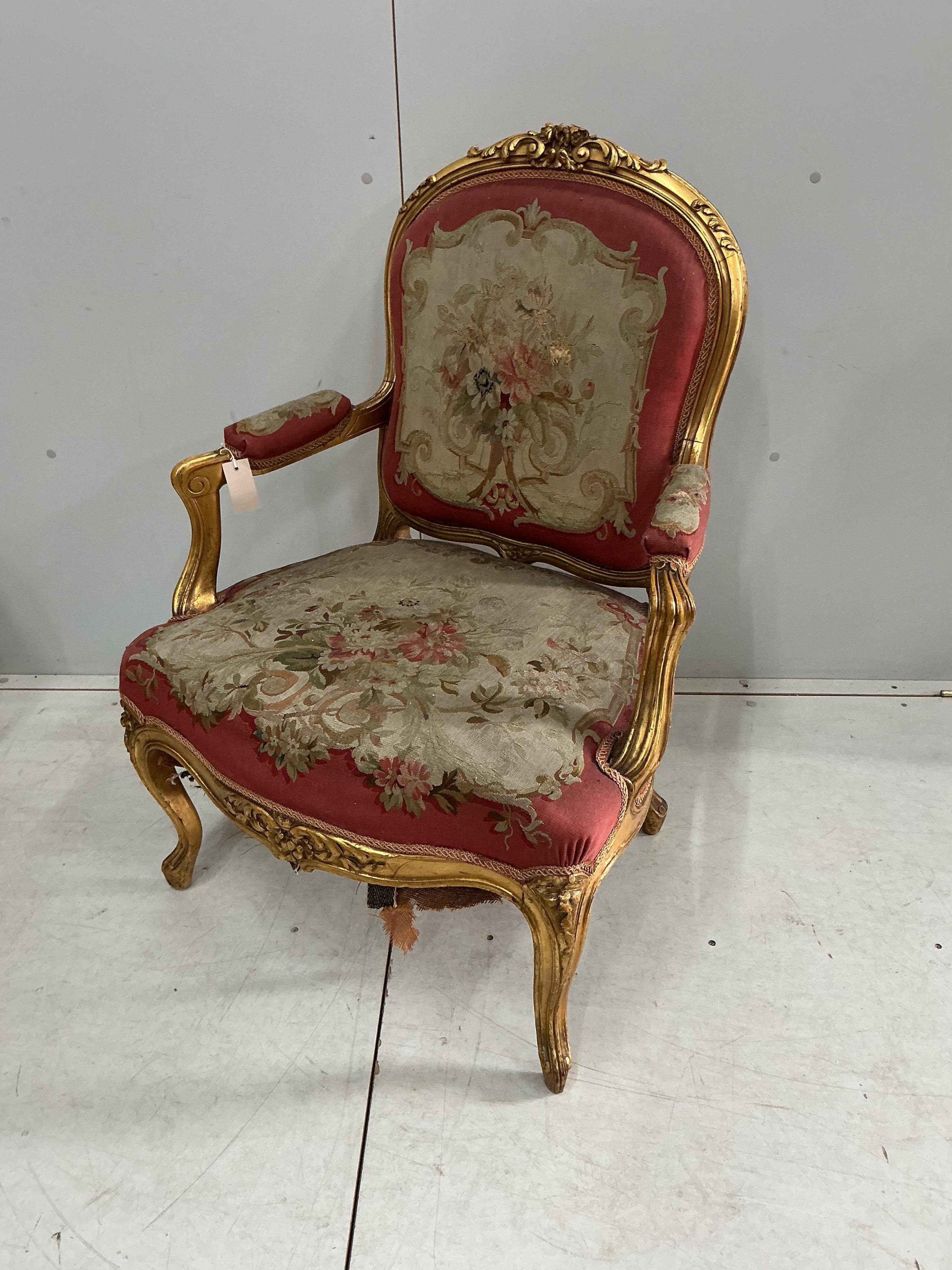 A pair of 18th century style giltwood and composition elbow chairs with petit point tapestry seats and backs, width 74cm, depth 52cm, height 96cm